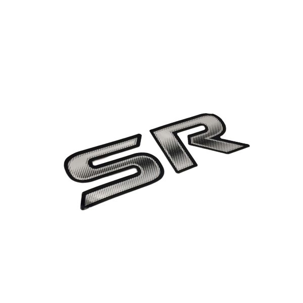 EMBLEMA "SR" PORTON TOYOTA HILUX 2005-2015 CALCOMANIA ORIGINAL - Imagen 1