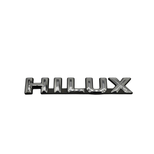 EMBLEMA "HILUX" HILUX 1992-2001 VA EN GUARDABARRO *MEDIDA 13CM X2 CM* Original