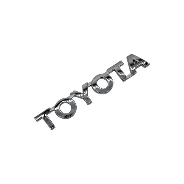 EMBLEMA "TOYOTA" PORTON HILUX 2016-2025 ORIGINAL - Imagen 1