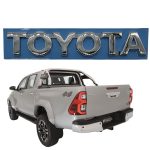 EMBLEMA "TOYOTA" PORTON HILUX 2016-2025 REVO SPT - Imagen 5